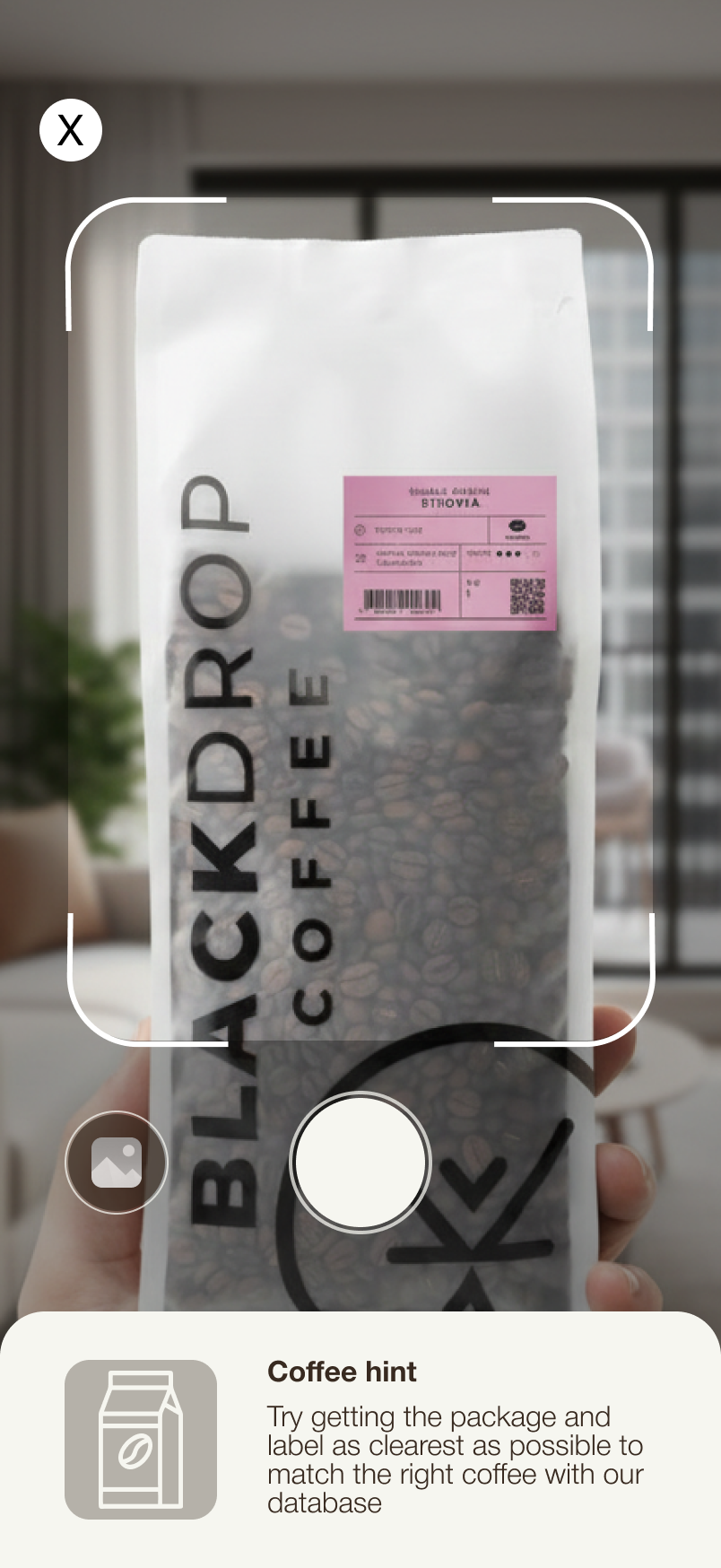 Beanhood app scanning a coffee bag with viewfinder overlay and coffee hint at bottom